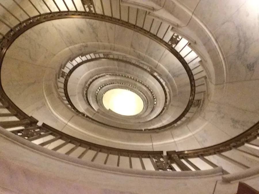 Spiral marble staircase inside a historic courthouse
